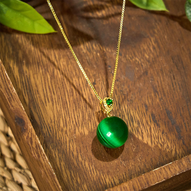 Collier avec pendentif boule ronde œil de chat en Buddha Stones
