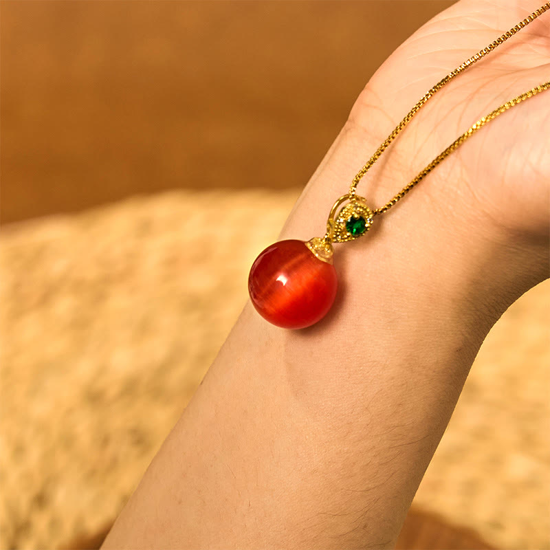 Collier avec pendentif boule ronde œil de chat en Buddha Stones