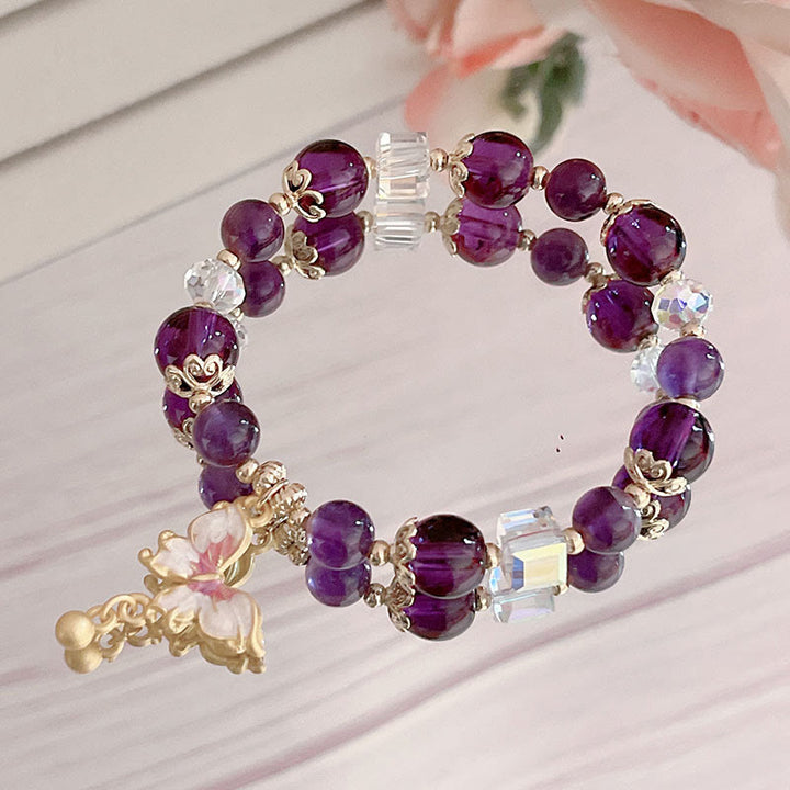 Bracelet de paix papillon en pierre de soleil améthyste naturelle de Buddha Stones