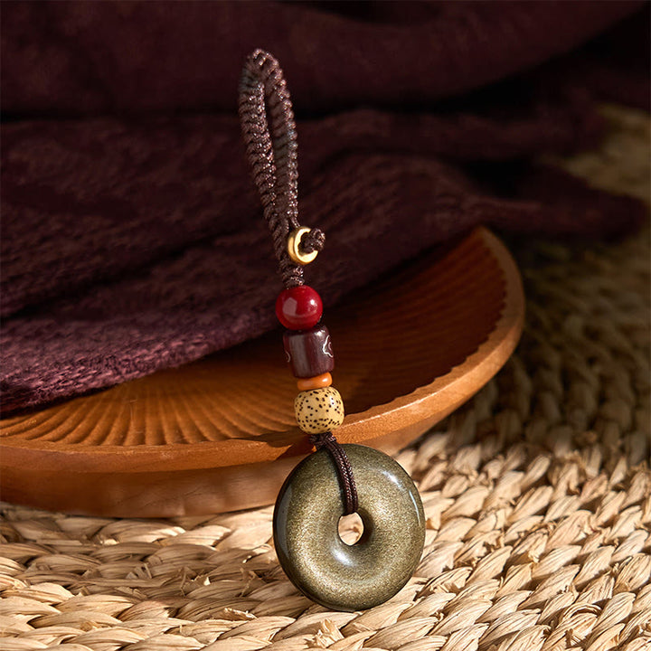 Porte-clés renforcé avec boucle de paix en obsidienne naturelle et Buddha Stones