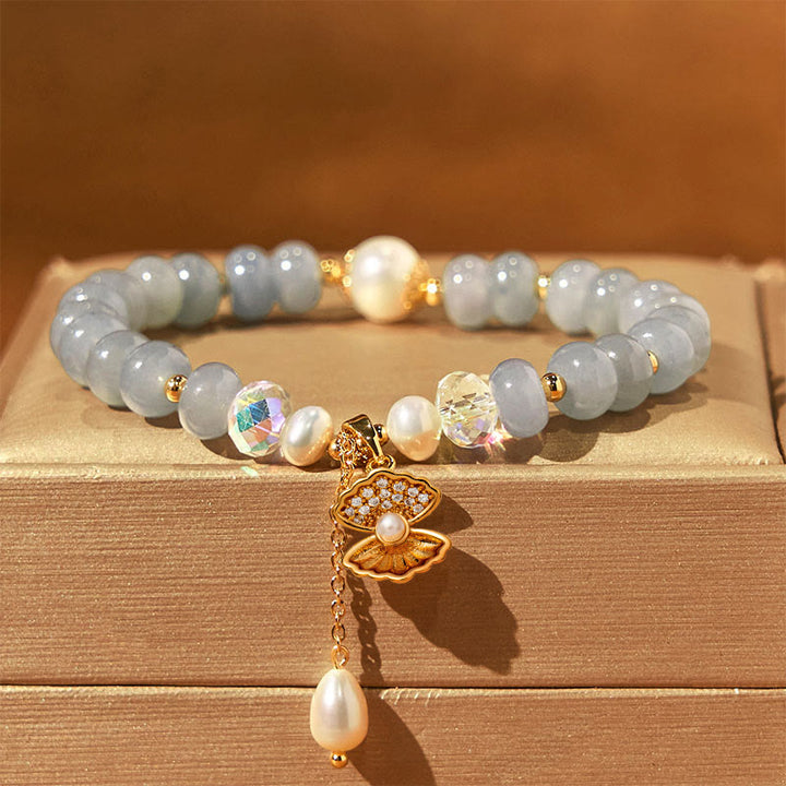 Bracelet de perles de guérison en coquillages et aigue-marines naturelles de Buddha Stones