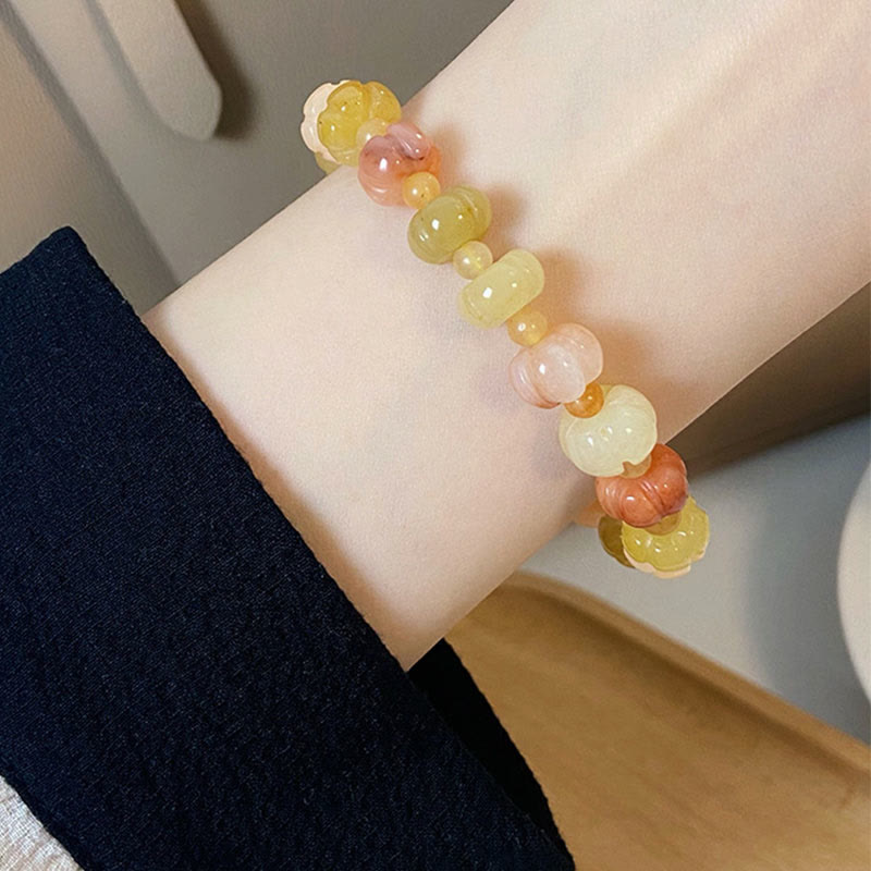 Bracelet Buddha Stones, soie dorée, jade, perles citrouille, richesse, chance