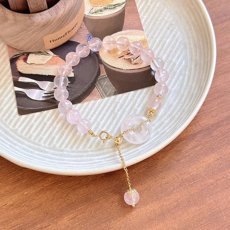Bracelet d'acceptation de soi avec boucle de paix et perles de cristal rose naturel en Buddha Stones