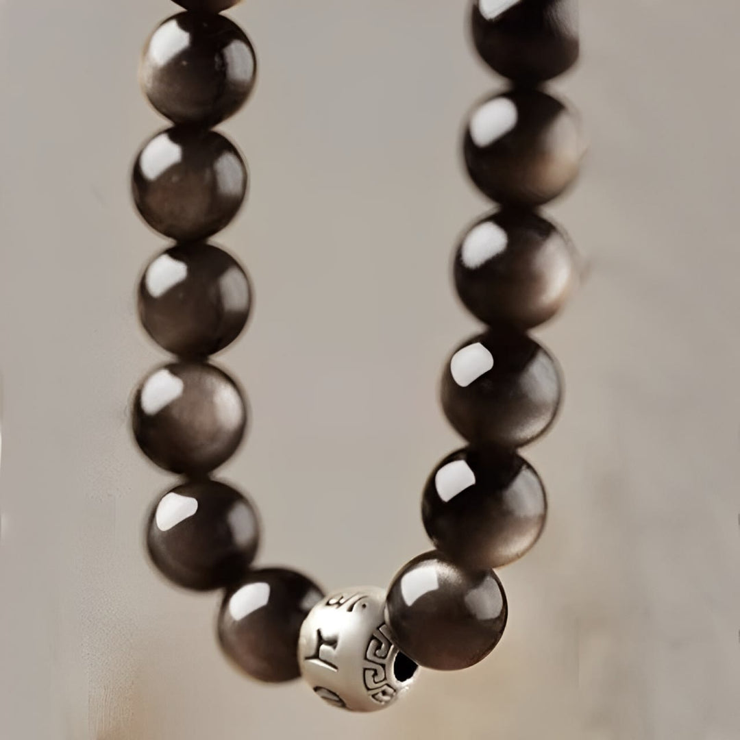 Bracelet de protection Om Mani Padme Hum en obsidienne naturelle Buddha Stones et brillante