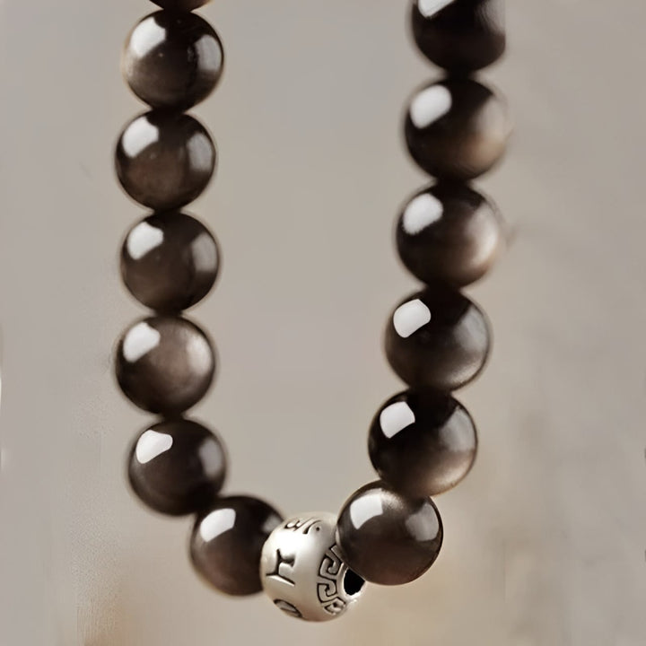 Bracelet de protection Om Mani Padme Hum en obsidienne naturelle Buddha Stones et brillante