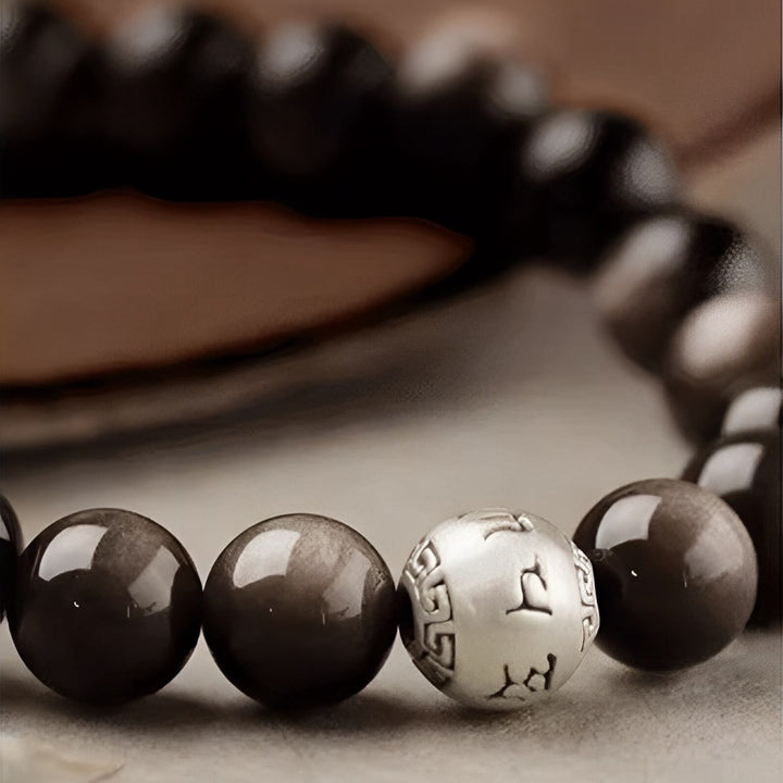 Bracelet de protection Om Mani Padme Hum en obsidienne naturelle Buddha Stones et brillante