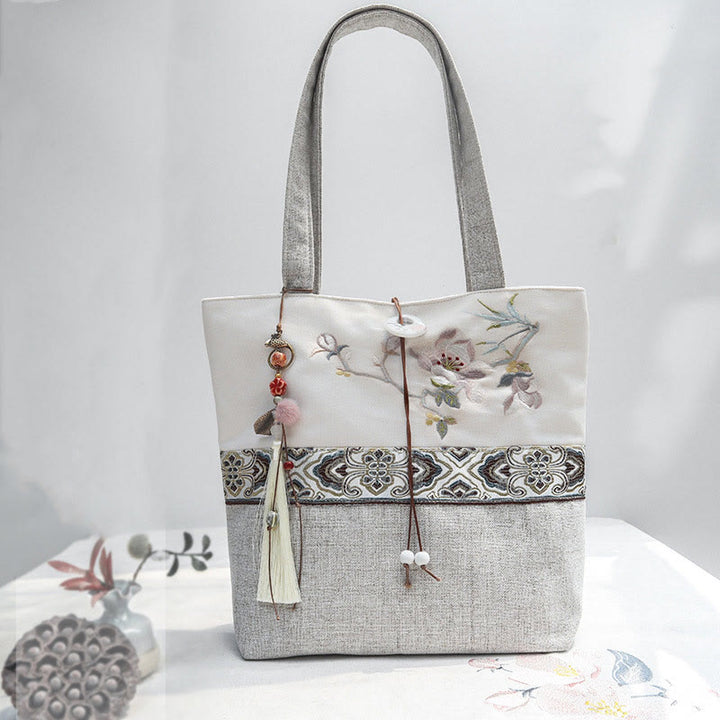 Sac à bandoulière en toile polyester brodé Buddha Stones Magnolia