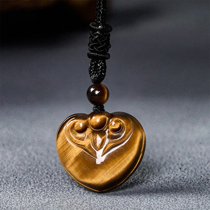 Collier pendentif en corde de protection avec motif cœur et œil de tigre naturel en Buddha Stones