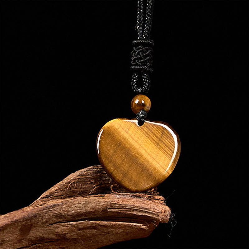 Collier pendentif en corde de protection avec motif cœur et œil de tigre naturel en Buddha Stones