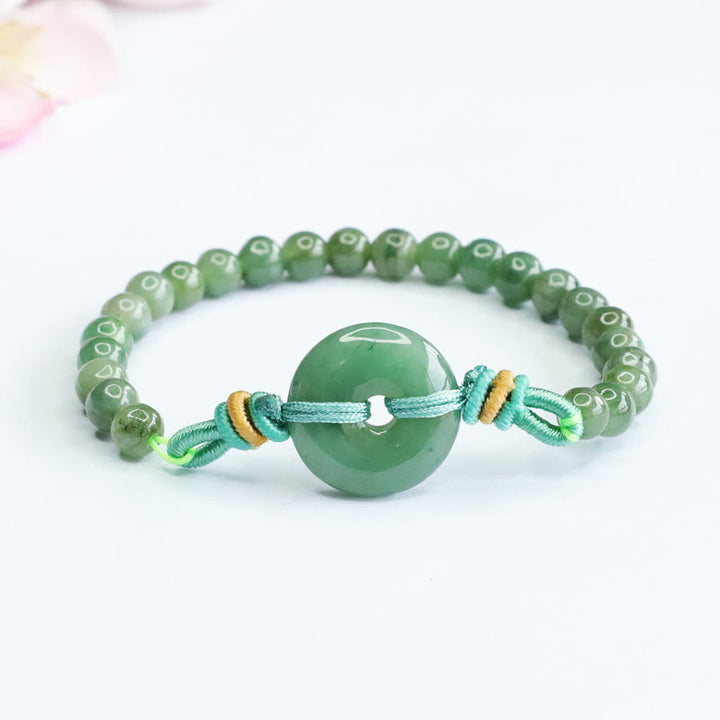 Bracelet de prospérité avec boucle de paix et perles de jade en Buddha Stones
