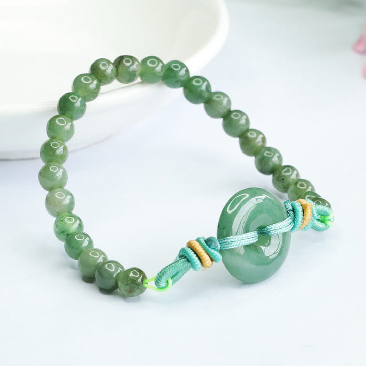 Bracelet de prospérité avec boucle de paix et perles de jade en Buddha Stones