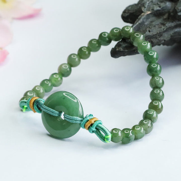 Bracelet de prospérité avec boucle de paix et perles de jade en Buddha Stones