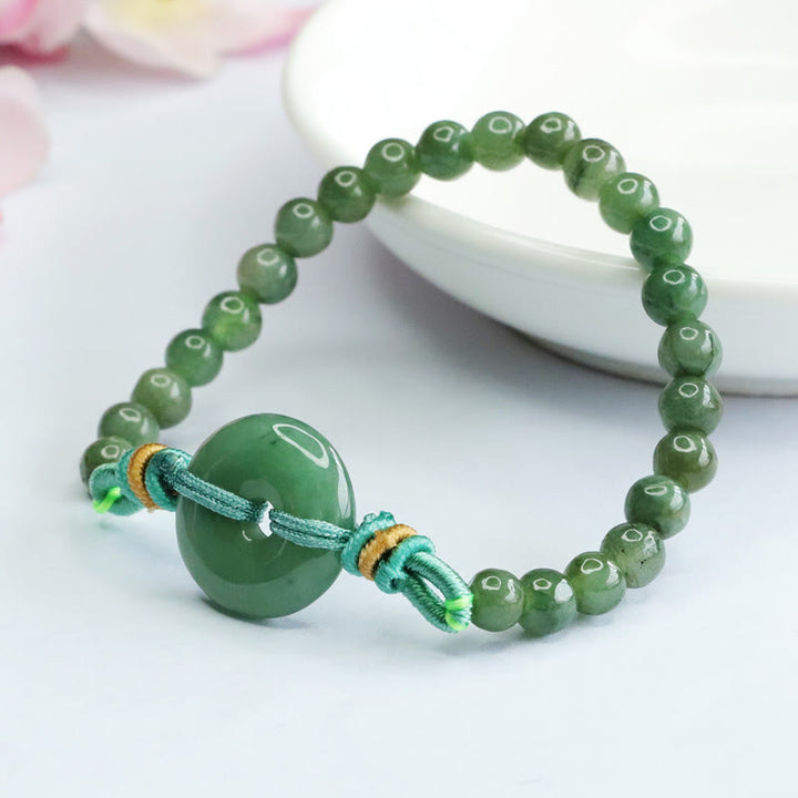 Bracelet de prospérité avec boucle de paix et perles de jade en Buddha Stones