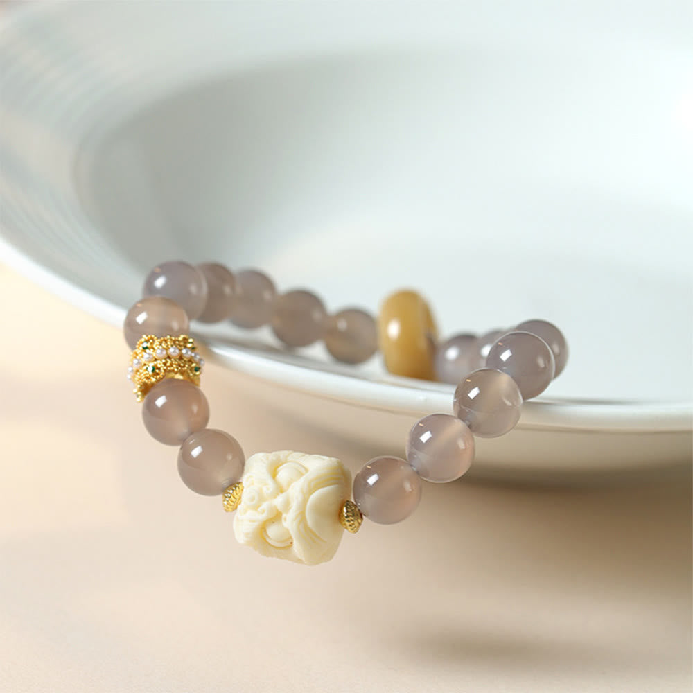 Bracelet de confiance en Buddha Stones, ambre, agate grise, ivoire et fruit