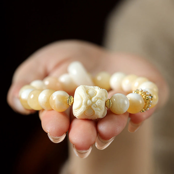 Bracelet de confiance en Buddha Stones, ambre, agate grise, ivoire et fruit