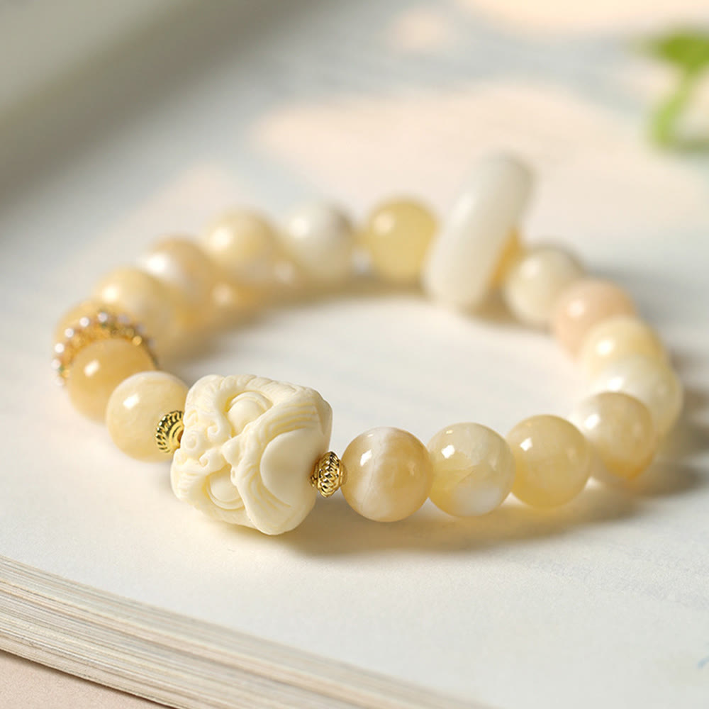 Bracelet de confiance en Buddha Stones, ambre, agate grise, ivoire et fruit