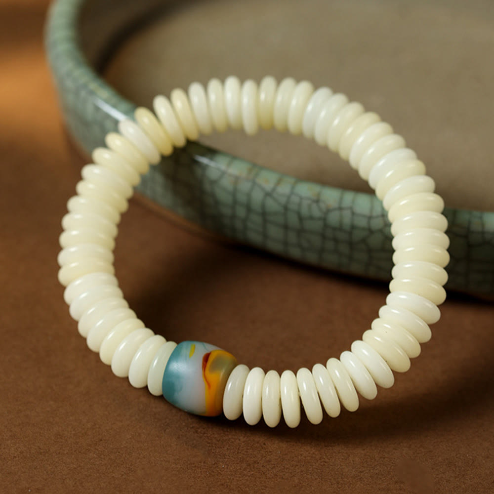 Bracelet à pompon en pierre de sagesse, pierre de graine de Bodhi blanche naturelle de Buddha Stones - image 1