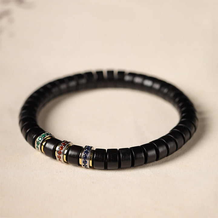 Bracelet de paix en bois d' Buddha Stones et petites feuilles de santal rouge et zircon