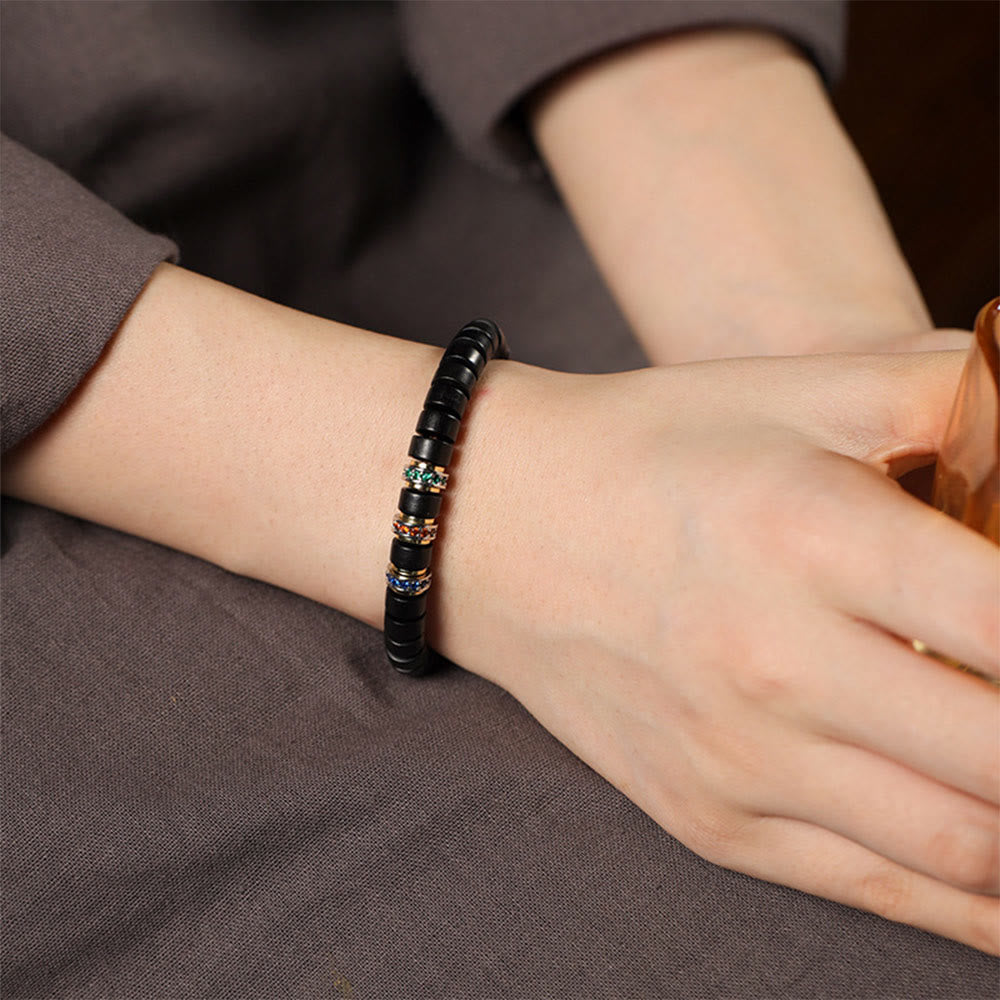 Bracelet de paix en bois d' Buddha Stones et petites feuilles de santal rouge et zircon