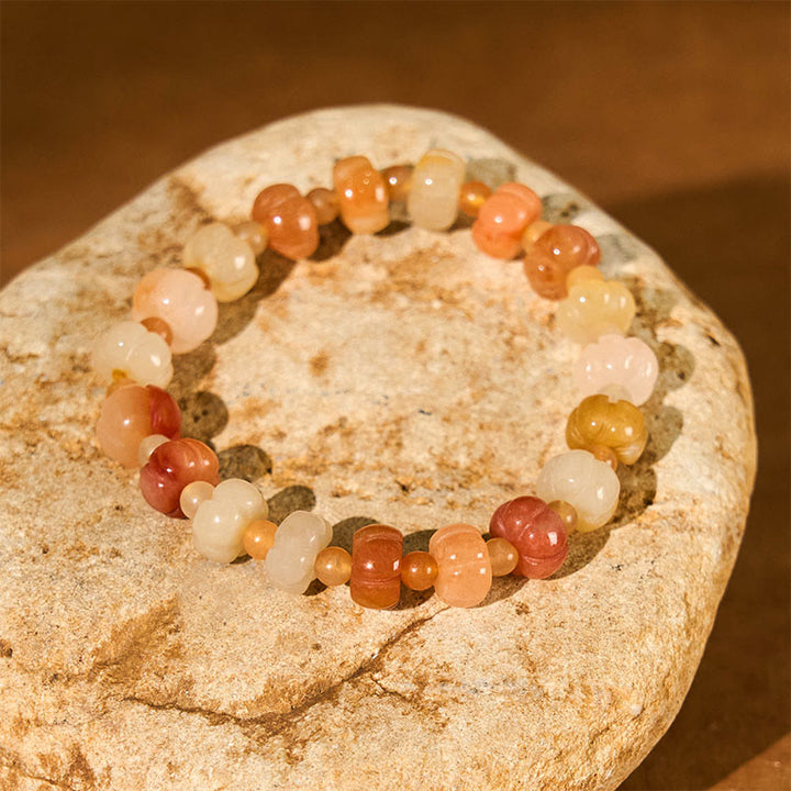 Bracelet Buddha Stones, soie dorée, jade, perles citrouille, richesse, chance
