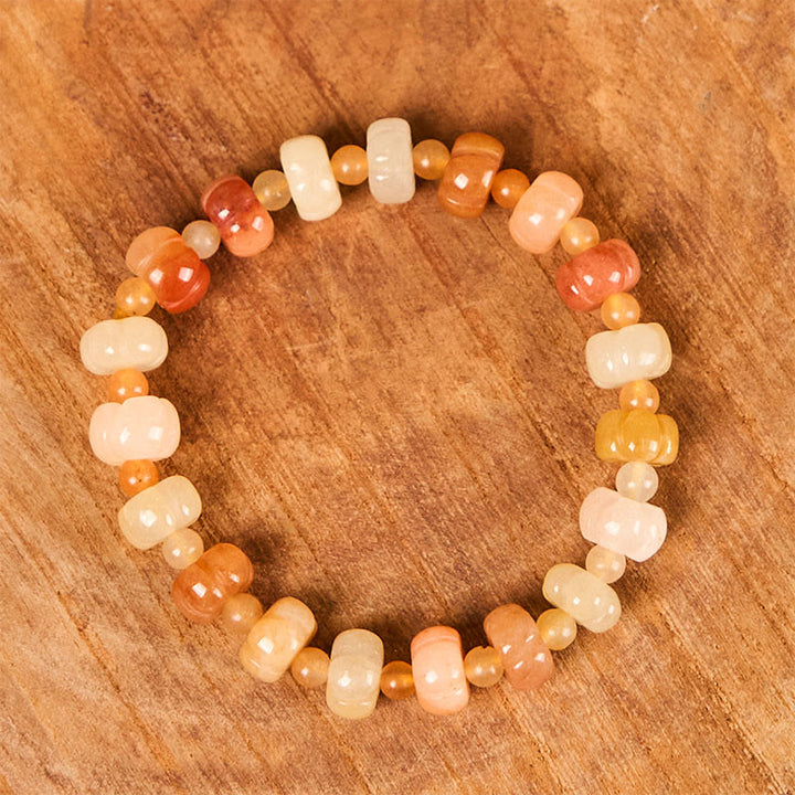 Bracelet Buddha Stones, soie dorée, jade, perles citrouille, richesse, chance