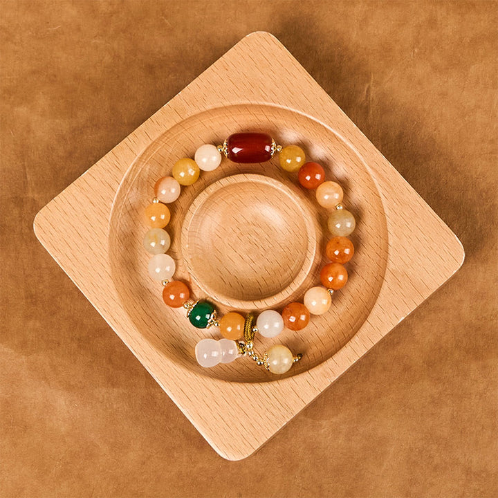 Bracelet porte-bonheur en perles de jade et soie dorées, Buddha Stones