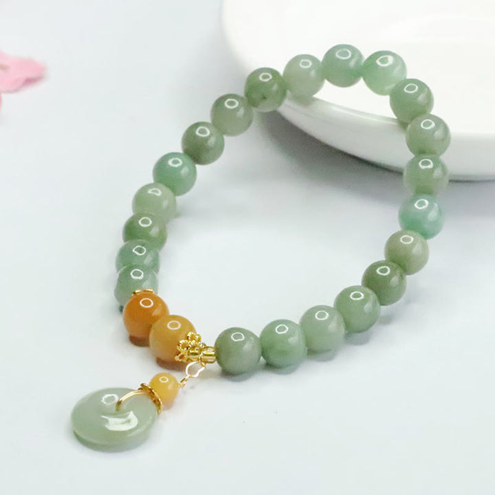 Bracelet de prospérité et d'abondance en perles de jade et Buddha Stones