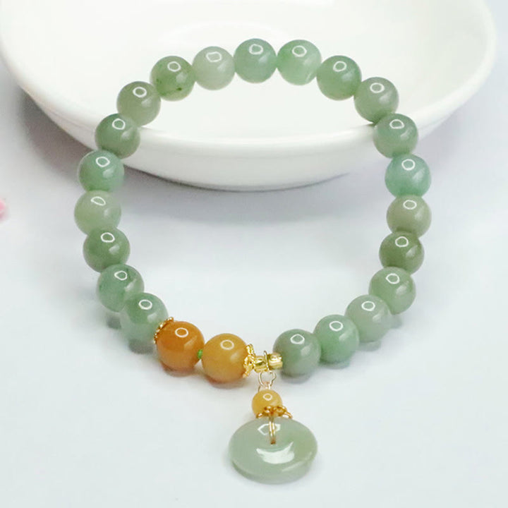 Bracelet de prospérité et d'abondance en perles de jade et Buddha Stones