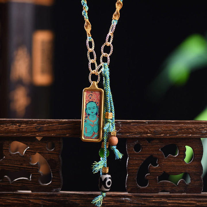 Buddha Stones pendentif Thangka en acier titane représentant le dieu de la richesse du Tibet