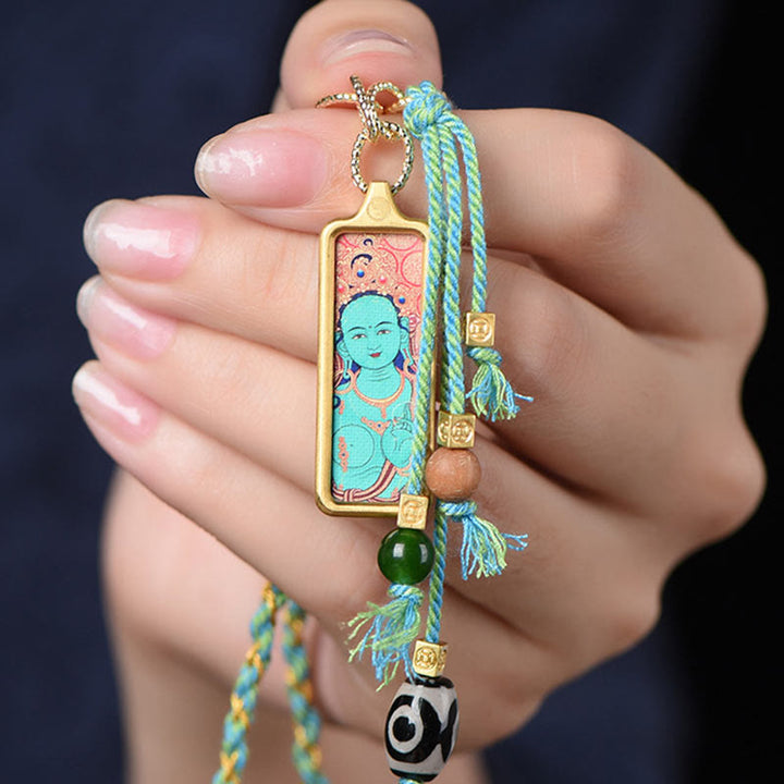 Buddha Stones pendentif Thangka en acier titane représentant le dieu de la richesse du Tibet