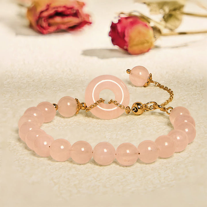 Bracelet d'acceptation de soi avec boucle de paix et perles de cristal rose naturel en Buddha Stones