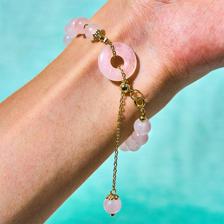 Bracelet d'acceptation de soi avec boucle de paix et perles de cristal rose naturel en Buddha Stones