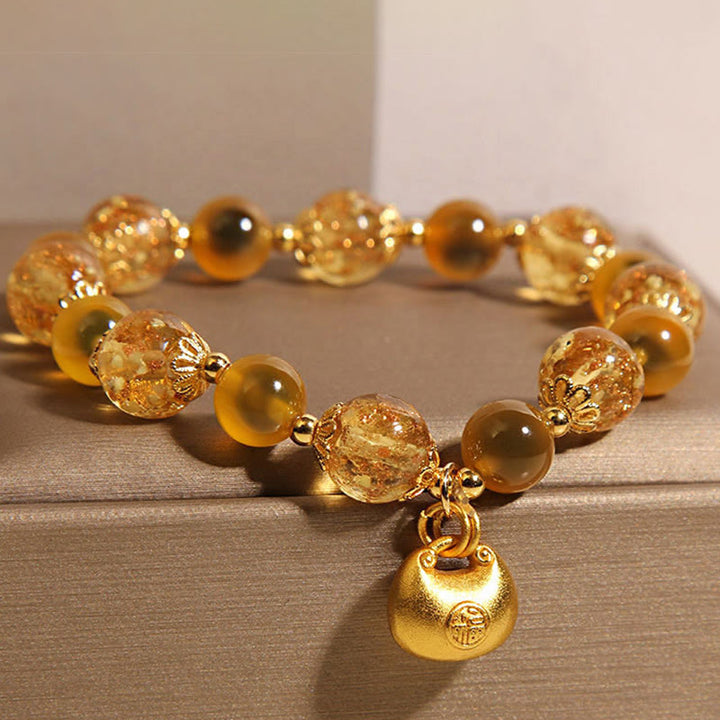 Bracelet de guérison en agate jaune bonbon avec Buddha Stones et personnage Fu