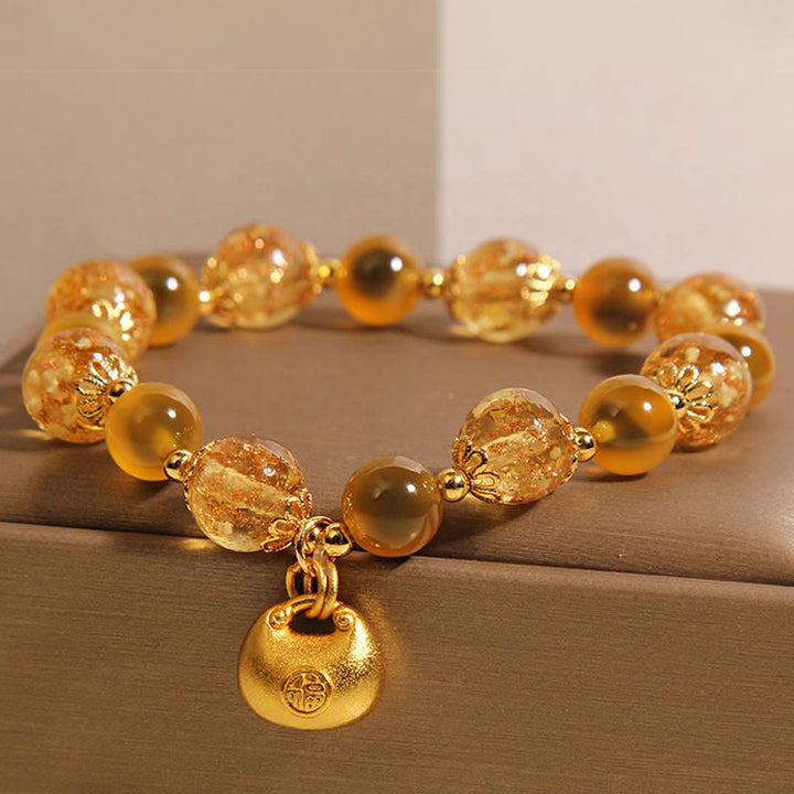 Bracelet de guérison en agate jaune bonbon avec Buddha Stones et personnage Fu