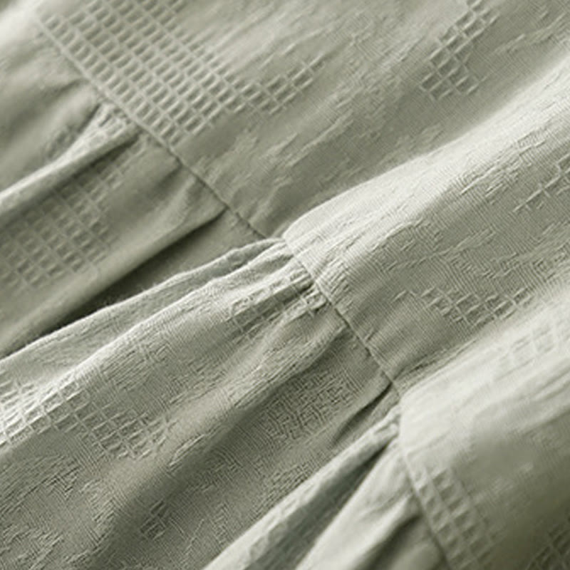 Robe mi-longue d'été en coton à manches courtes et col ras du cou avec poignets élastiques et jacquard uni Buddha Stones