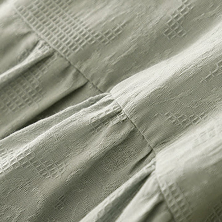 Robe mi-longue d'été en coton à manches courtes et col ras du cou avec poignets élastiques et jacquard uni Buddha Stones