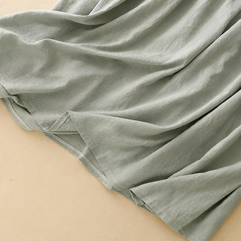 Robe mi-longue d'été en coton à manches courtes et col ras du cou avec poignets élastiques et jacquard uni Buddha Stones