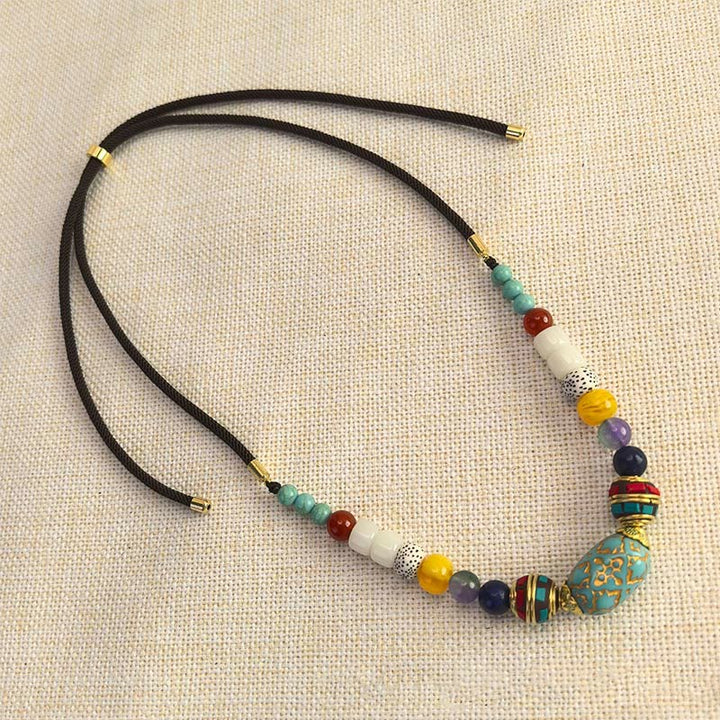 Collier pendentif en perles turquoises tibétaines faites à la main avec Buddha Stones