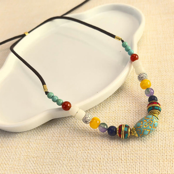 Collier pendentif en perles turquoises tibétaines faites à la main avec Buddha Stones
