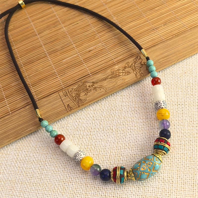 Collier pendentif en perles turquoises tibétaines faites à la main avec Buddha Stones