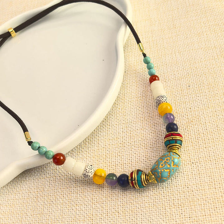 Collier pendentif en perles turquoises tibétaines faites à la main avec Buddha Stones