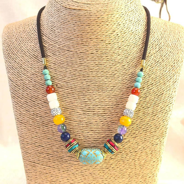 Collier pendentif en perles turquoises tibétaines faites à la main avec Buddha Stones