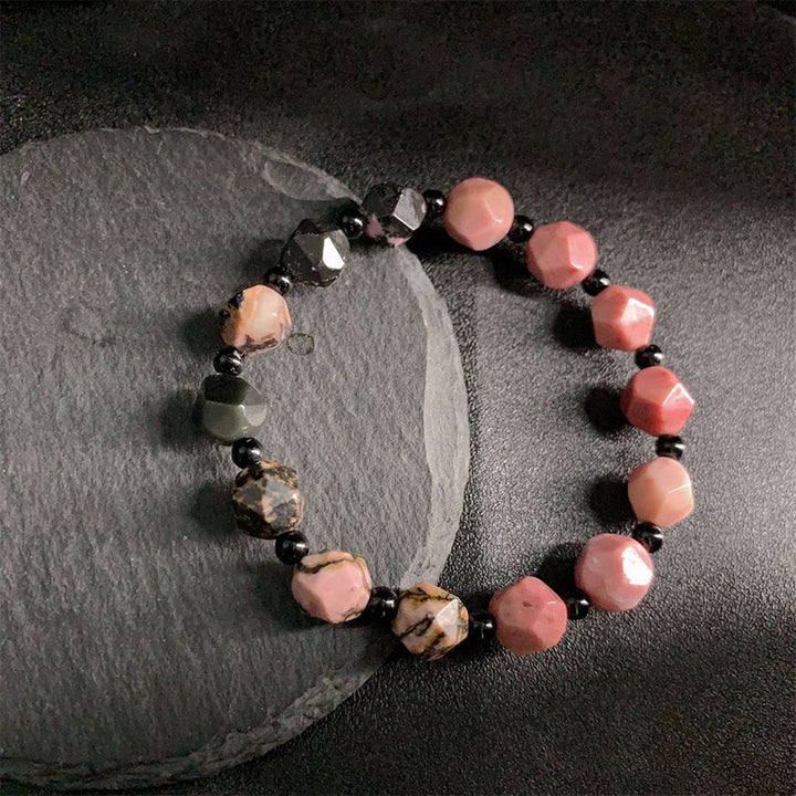 Bracelet de guérison en perles polygonales en pierre de Buddha Stones naturelle à lignes noires et à taches rouges