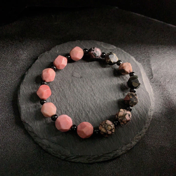 Bracelet de guérison en perles polygonales en pierre de Buddha Stones naturelle à lignes noires et à taches rouges