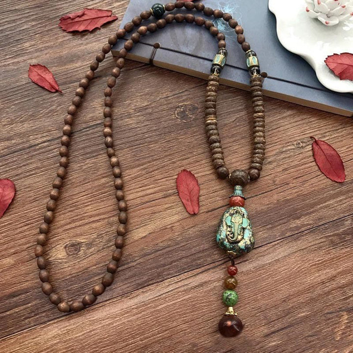 Collier pendentif tête d'éléphant en perles dzi de protection en bois de wengé Buddha Stones fait main