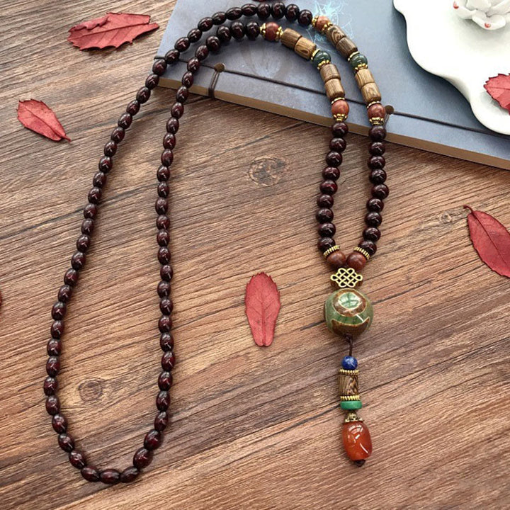 Collier pendentif tête d'éléphant en perles dzi de protection en bois de wengé Buddha Stones fait main