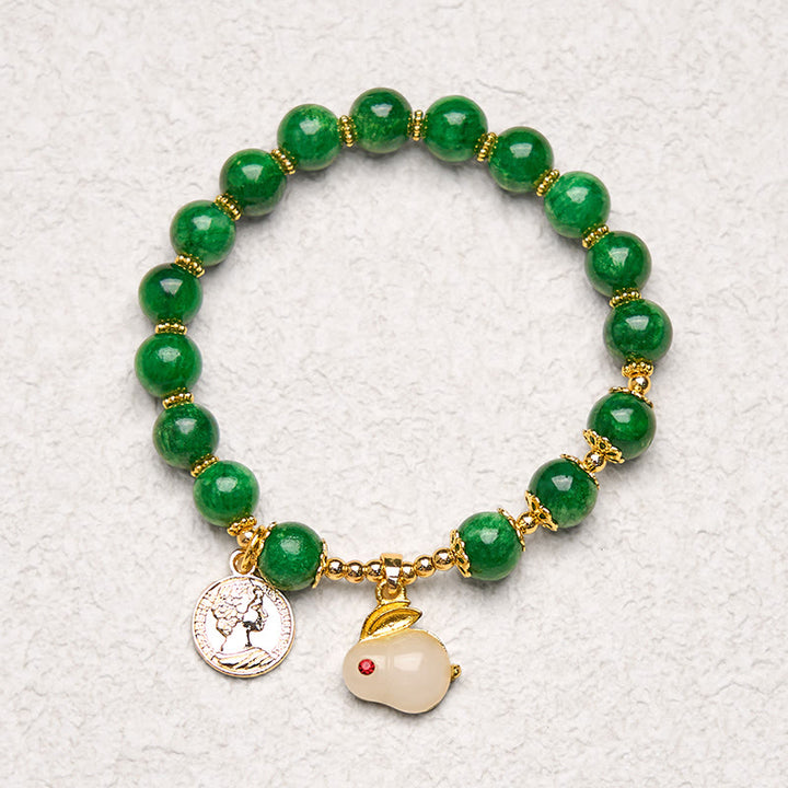 Bracelet en calcite verte et Buddha Stones avec breloque en forme de lapin