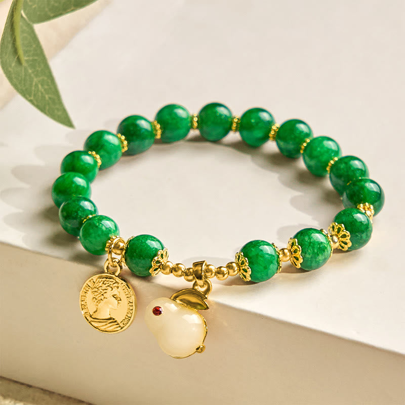 Bracelet en calcite verte et Buddha Stones avec breloque en forme de lapin