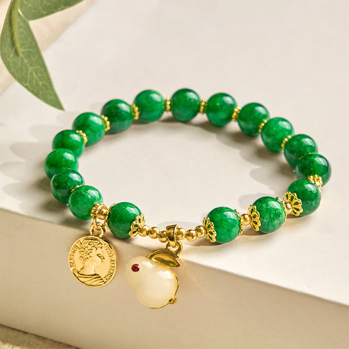 Bracelet en calcite verte et Buddha Stones avec breloque en forme de lapin