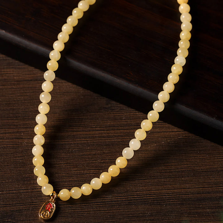 Bracelet de richesse double cercle en jade et perles de topaze de Buddha Stones